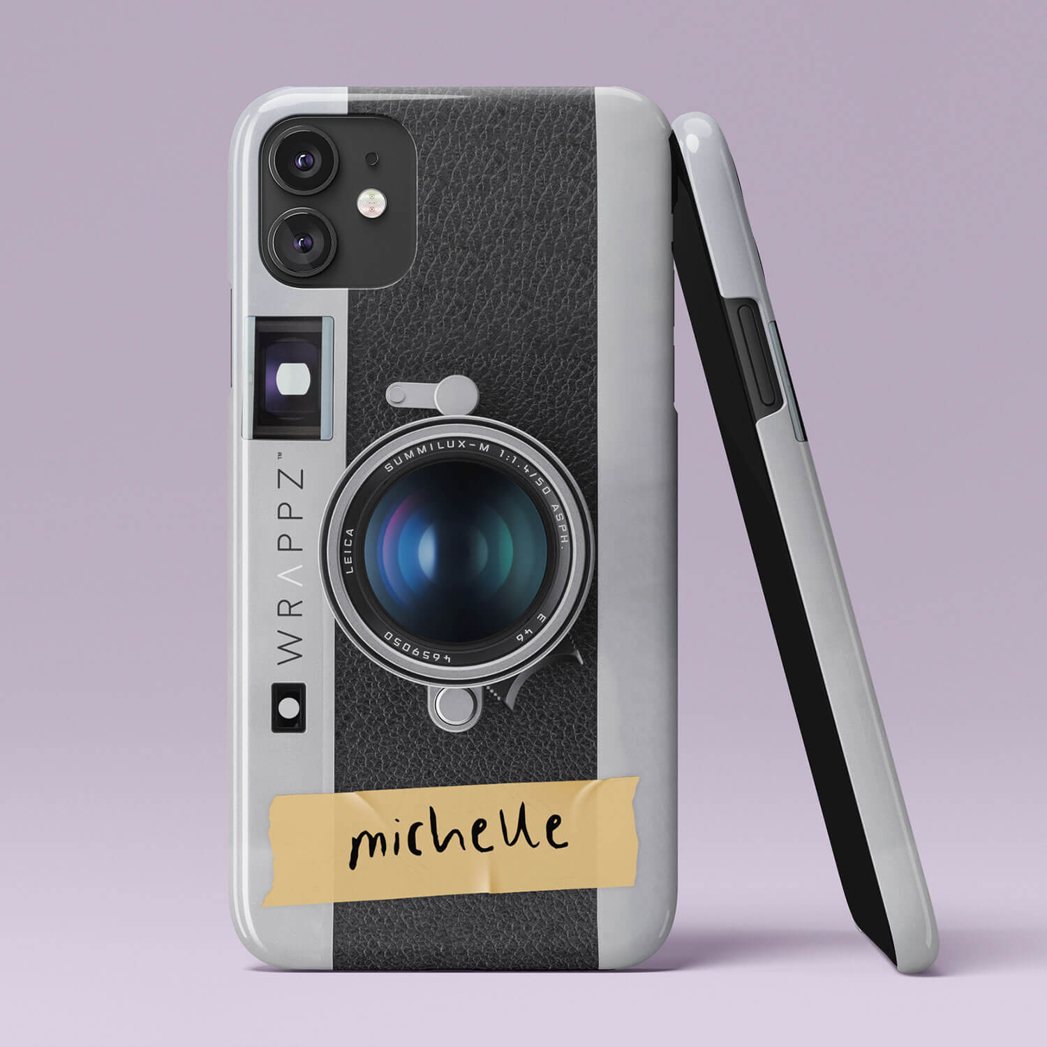 Wrappz phone case that looks like a retro Leica camera and a custom name.